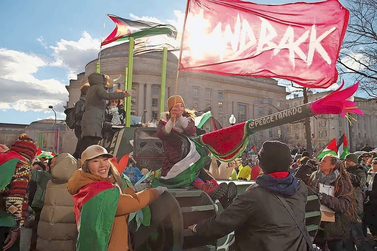 Pro-Hamas activists wheel a mock tank into Freedom Plaza during a “March for Gaza” on Jan. 13.