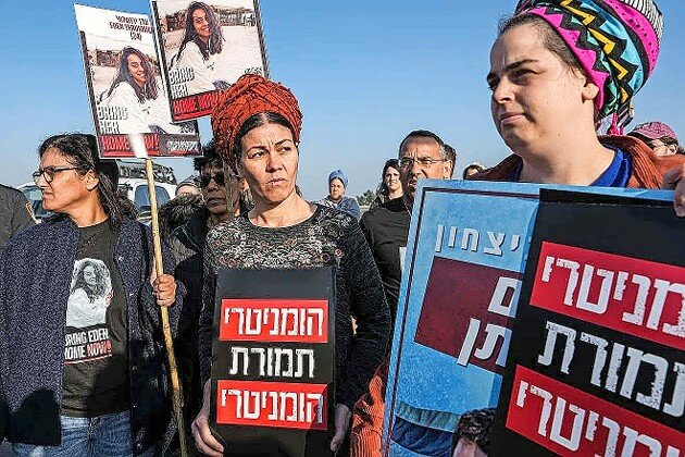 Parents of Israeli soldiers in the Gaza Strip and other activists protest near the Kerem Shalom border crossing in southern Israel against trucks of humanitarian aid that Hamas takes for its own use, on Jan. 9.