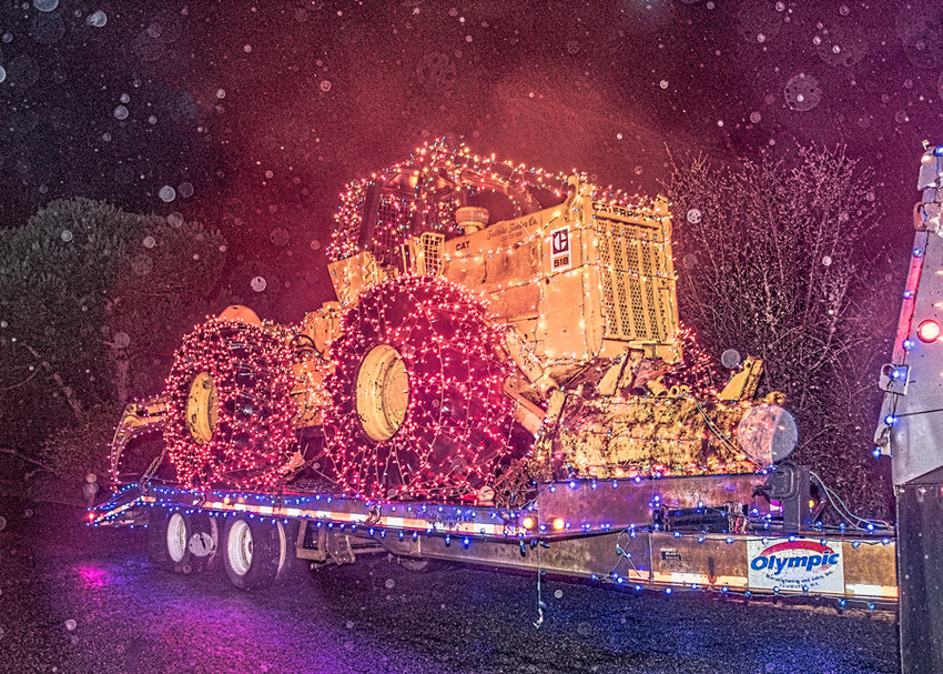 Logger John Jaggi&rsquo;s big toy on tour in the First Annual Home Parade of Lights.