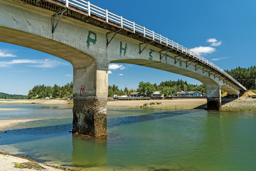 Built in 1936, the Purdy Bridge is graded as &ldquo;poor condition&rdquo; by WSDOT. Concrete pier deterioration seen here at low tide is slated for repair this summer.