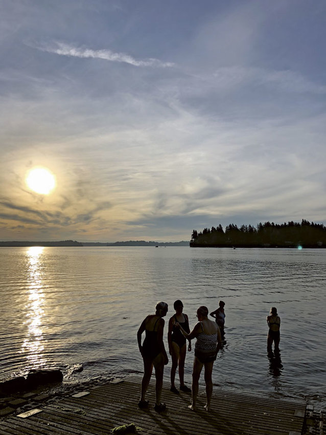 Early morning swimmers meet on Von Geldern Cove.