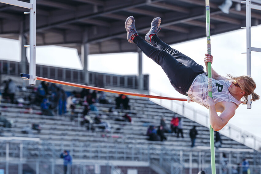 Pole vaulter leaps into spring for Peninsula High School.