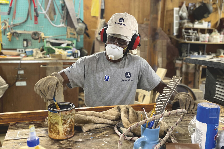 AmeriCorps Volunteer Darnell Crumity of Tacoma at work in the shop.