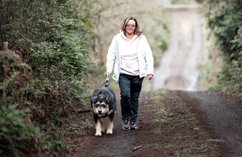 Stephanie Brooks gets some exercise while enjoying a walk with her beloved dog, Porter.