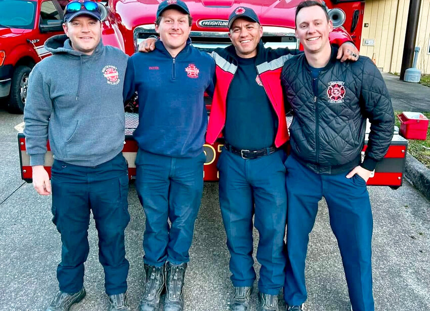 Local firefighters returned home Jan. 25 from their deployment fighting wildfires in and around Los Angeles. From left, Firefighter/Paramedic Jimmy Dane and Firefighter Marty Pattin of Gig Harbor Fire &amp; Medic One joined FF/PM Lt. Adam Morse and FF/PM Kevin Koehl of Key Peninsula Fire District 16. Their deployment was part of a Pierce/Kitsap/King County Strike Team consisting of five engines and a Strike Team Leader.