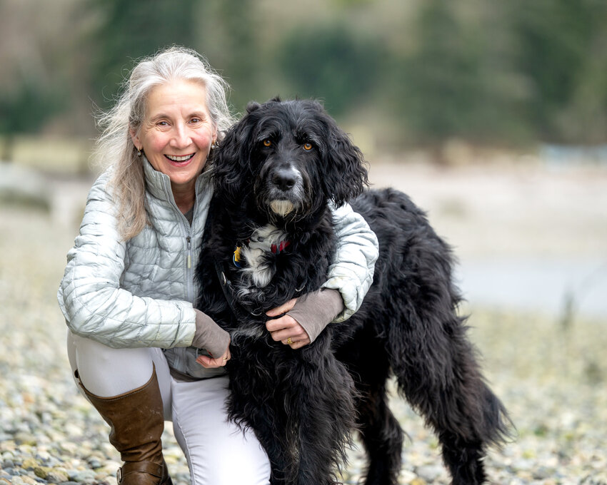 Jane Jones on the beach with her dog, Eulee.
