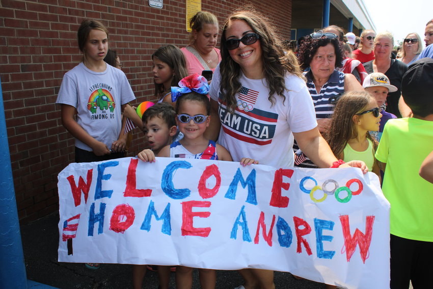 Aidan, Angelina and Christina Gill, of Levittown, helped welcome Capobianco home. Angelina wore her gymnastics uniform to the gathering. 