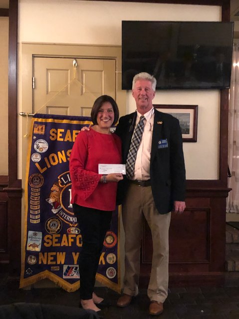 Lions Club President George Brennan with guest speaker Terrie Magro at the Oct. 5 club meeting at Runyon’s