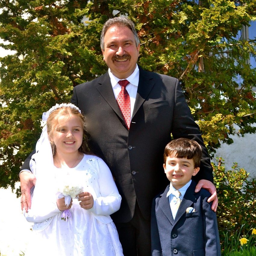 Mary and Paul Saporito with their father, Jeffrey, in May 2015. The siblings, whose mother died several years ago, lost their father to Covid-19 last month.