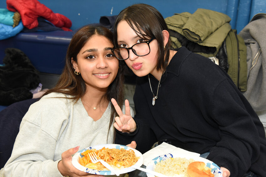 Subhana Washon, 15, and Charlotte Luna, 16, tried a variety of foods at the Taste of Marion event on Feb. 27.