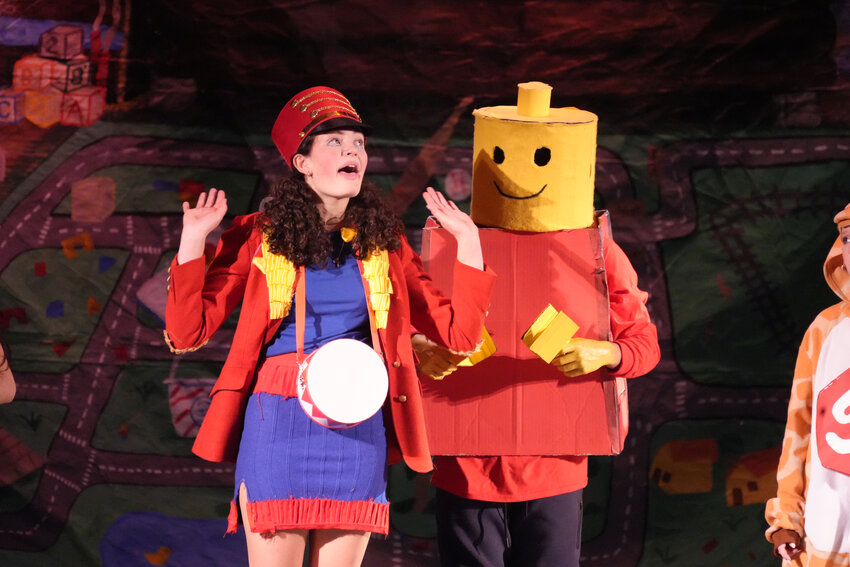 Fiona Duffy, left, and Jonathan Moya sported Lego costumes for the East Rockaway performance.