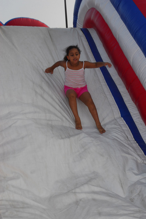 Crisangely Henriquez, 6, took a trip down the inflatable slide at the National Night Out on Aug. 4.