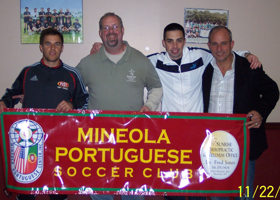 Dr. Fred Jones, second from left, with members of the Mineola Portugese Soccer Club.