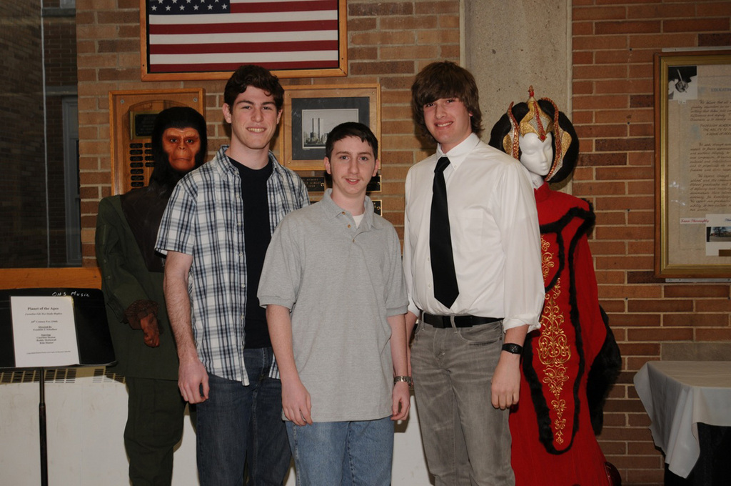 Student filmmakers Andrew Scibelli, Ben Czerwin, and Dan Grote pose with some memorable movie characters.
