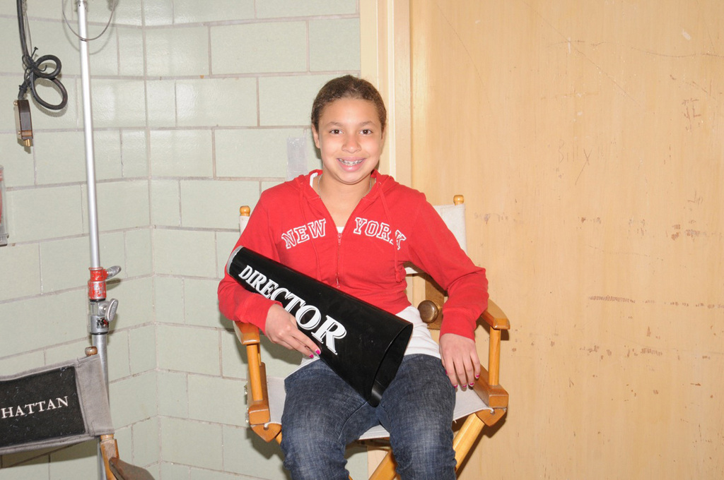 Sixth-grader Jillian Morales takes a seat in the director’s chair.