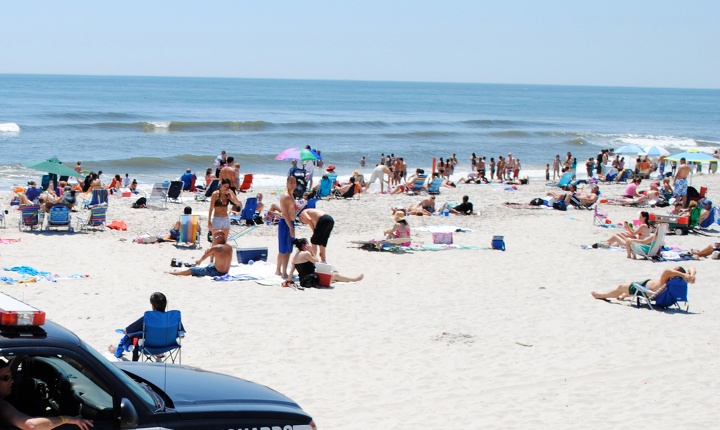 sunbathers enjoy the beach at Monroe Boulevard on Sunday, four days after a Long Beach police SUV ran over an Oceanside man in a lounge chair on the beach. The man was brought to Nassau County University Medical Center. He was released on Saturday.