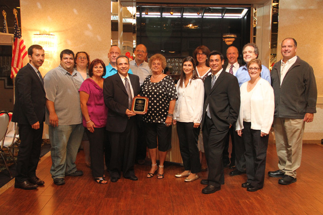 The West Hempstead Kiwanis Club presented Antonino Scolieri, the founder of A&S Bagels, and his family with a plaque.