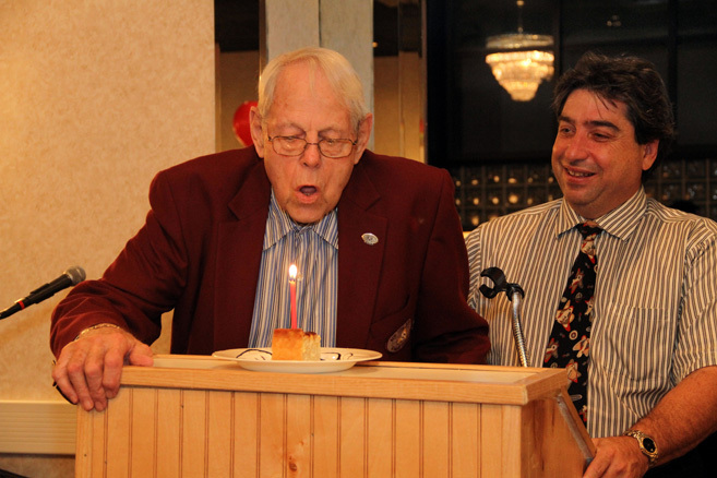 Kiwanis Secretary Bob Smith celebrated his 87th birthday, blowing out a candle presented by Ed Freeberg.