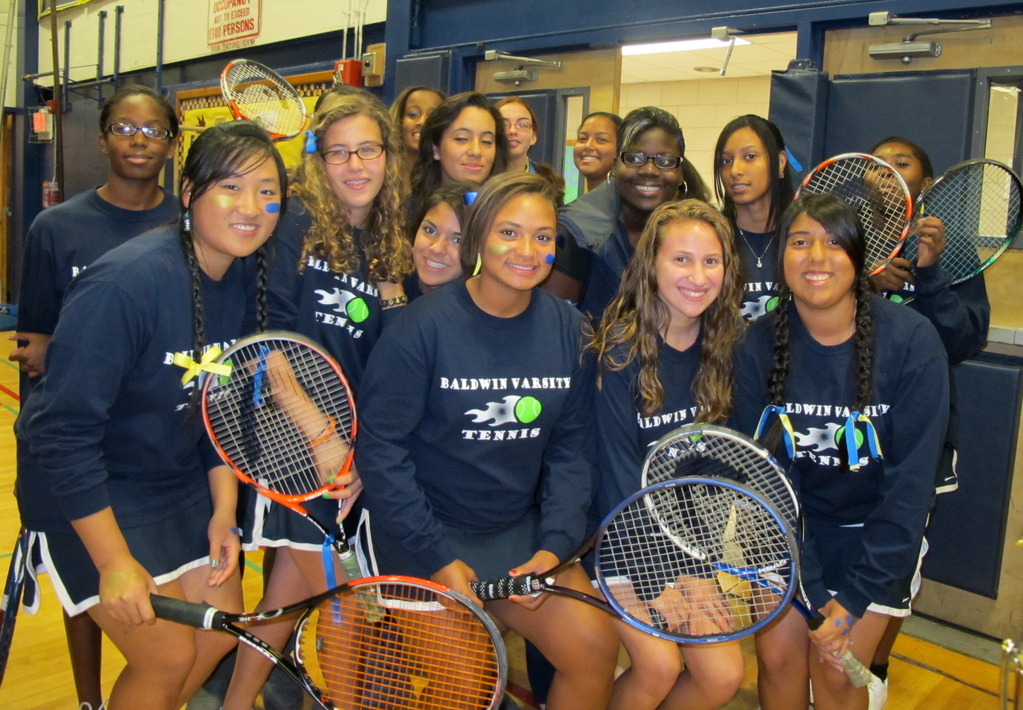 Racquets in hand, the tennis team served up some school spirit.