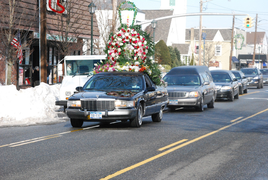A funeral procession down Long Beach Road in Island Park followed the services at Sacred Heart on Dec. 31, which Representative Peter King and Bishop William Murphy attended, among others.