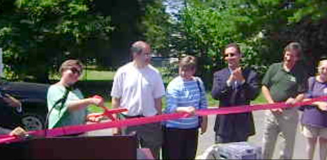 Nearly 100 people attended the Elmont Farmer's Market for its ribbon-cutting on June 30, at 11 a.m.