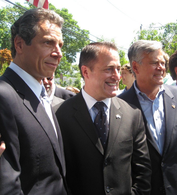 Cuomo, left was joined by Assemblyman Brian Curran and Sen. Dean Skelos at the signing of the law during a press conference in Lynbrook.