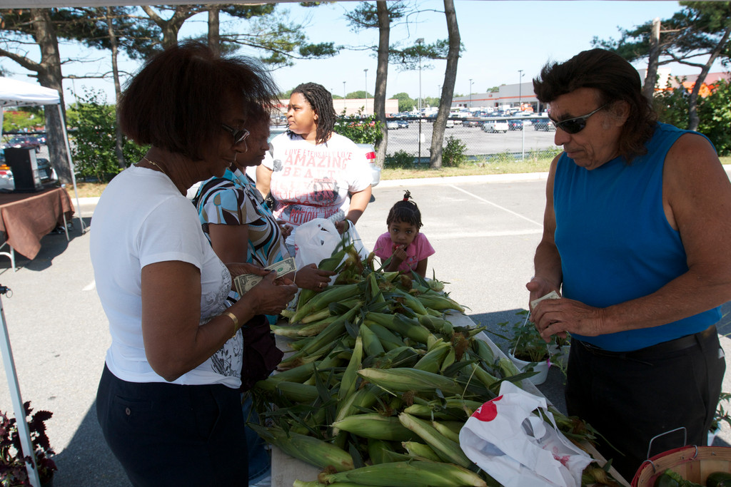 Cosmo Carucci, of Carucci Farms and Greenhouse, sold corn to customers at the Elmont Farmer's Market.