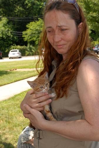 Barbara Zwart, of Levittown, who was caring for the cat and kittens, before they were taken by the Town of Hempstead Animal Shelter to be spayed and neutered.