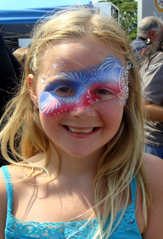 Shannon Byrne, 8, had her face painted a pretty pink and purple.