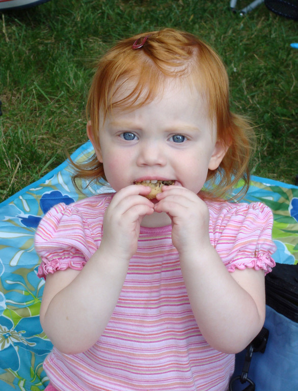 Melissa Chojnacki took a bite of her chocolate chip cookie at the picnic.