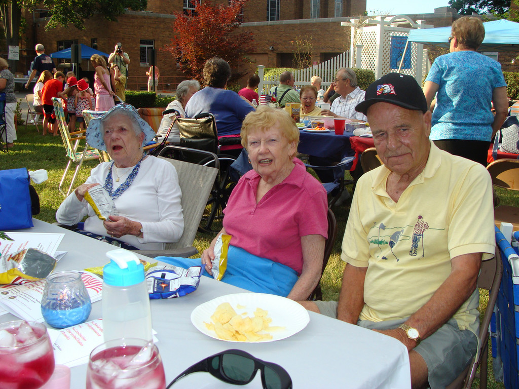 Peg Murphy, left, shares some fun and snacks with friends Joe and Fran Reisert.