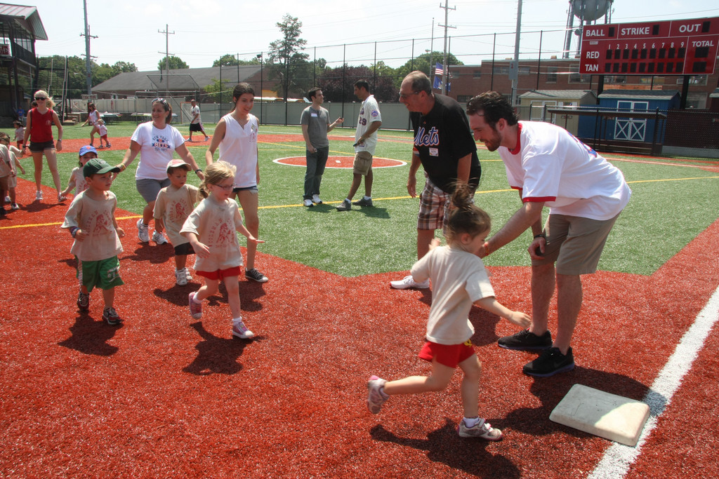 Davis high-fived campers as they rounded third base.