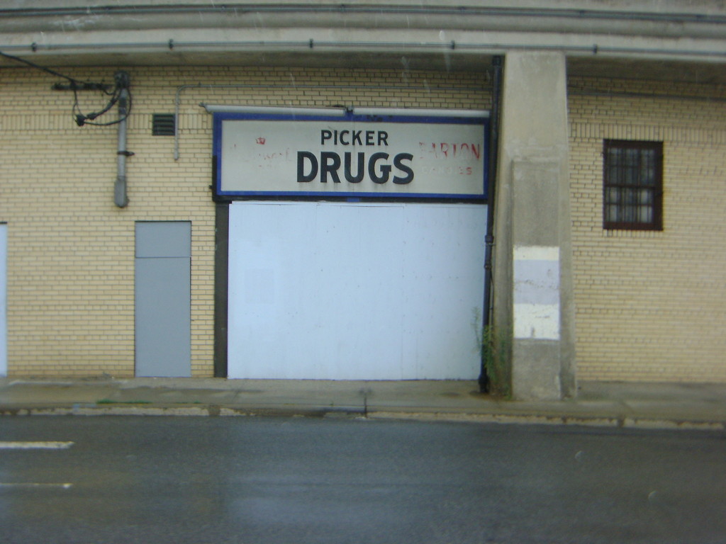 The old picker Drugs sign still hangs over the rundown doorway — even though the pharmacy moved further north on Atlantic Avenue in 2001.