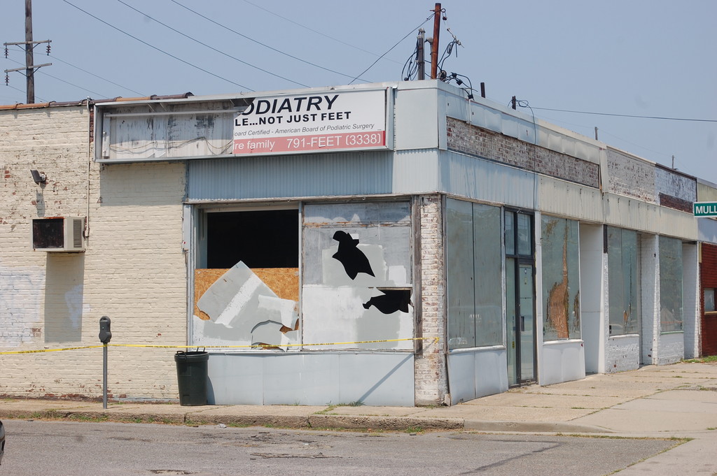 As of Wednesday afternoon, damage to the vacant Gibson Boulevard stores, which occurred early Saturday morning, had yet to be repaired.