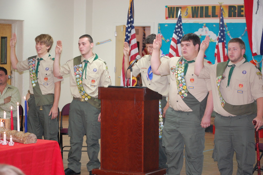 Eagle Scout Michael Trager, center, administers the Eagle Pledge to Valley Stream Troop 369 Boy Scouts, from left, Clayton Ambers, Salvatore Buttafuoco, William Hunter and Richard Capo at the July 17 Court of Honor ceremony.