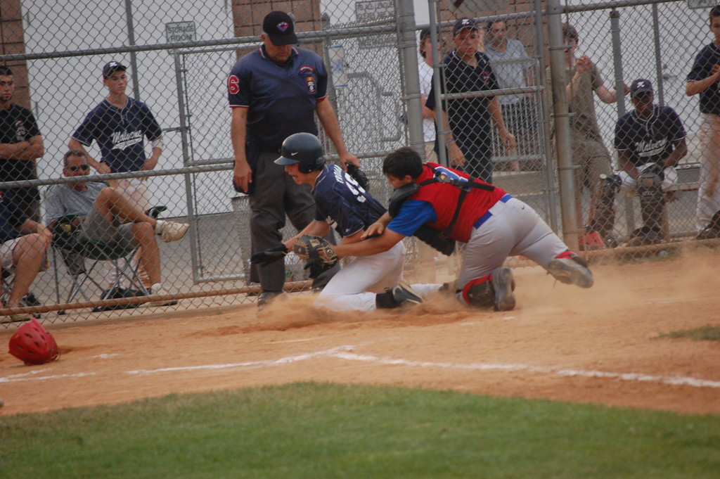 Valley Stream catcher Matt Russo made a tag at home plate, keeping a run off the board for Malverne.