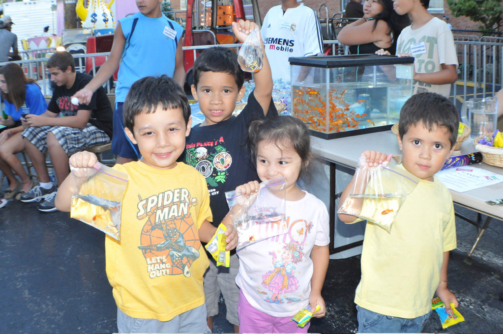 winning goldfish were, from left, Joseph Estevez, 4, Frankie Gonzalez, 5, Vanessa Estavez, 2 and David Gonzalez, 4, at the Blessed Sacrament Church fair.