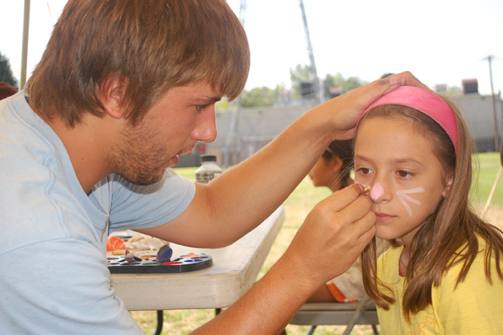 Natalie Pandolfi gets her face painted by counselor Terry Gagstetter at the Barrett Park summer camp’s Carnival Day on Aug. 5.