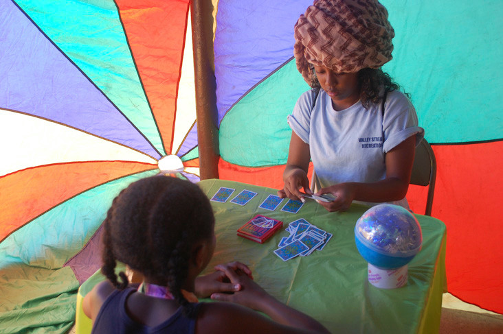 At a new event this year, counselor Ashley Altidor told children their fortunes.