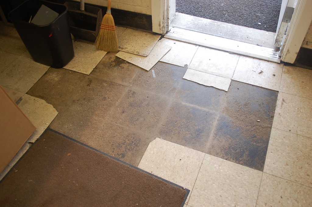 Damage to the floor of the Hendrickson Park administration building was visible after the water receded.