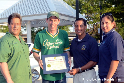 The Lynbrook Chamber of Commerce was presented with a Town of Hempstead citation by Town Clerk Mark Bonilla, second from right. Also pictured, from left, were Vice President of Membership Stephen Wangel, Car Show Chairman Harry Levitt, and Chamber Executive Vice President Denise Rogers.