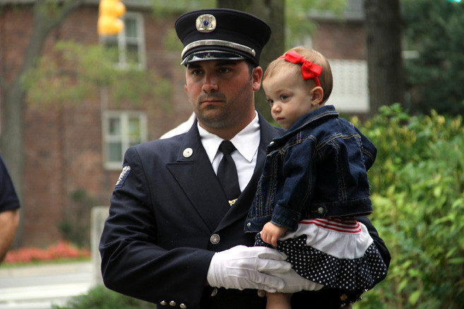 Lynbrook Firefighter Chris Kelly held his 17-month old daughter, Taylor.