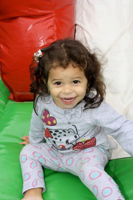 Melanie Quiroz, 1, of Elmont, loved the rides at the street fair.