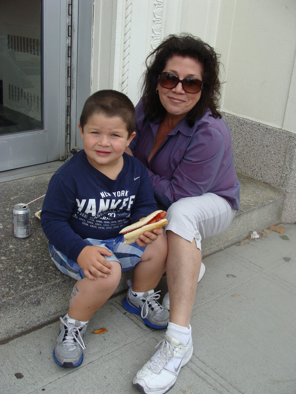 Mother and son stop for a quick hot dog during the fair.