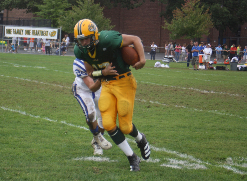 Quarterback Luke Spitzer rushed for 288 yards, leading the Owls to a homecoming victory over the Blue Dragons.