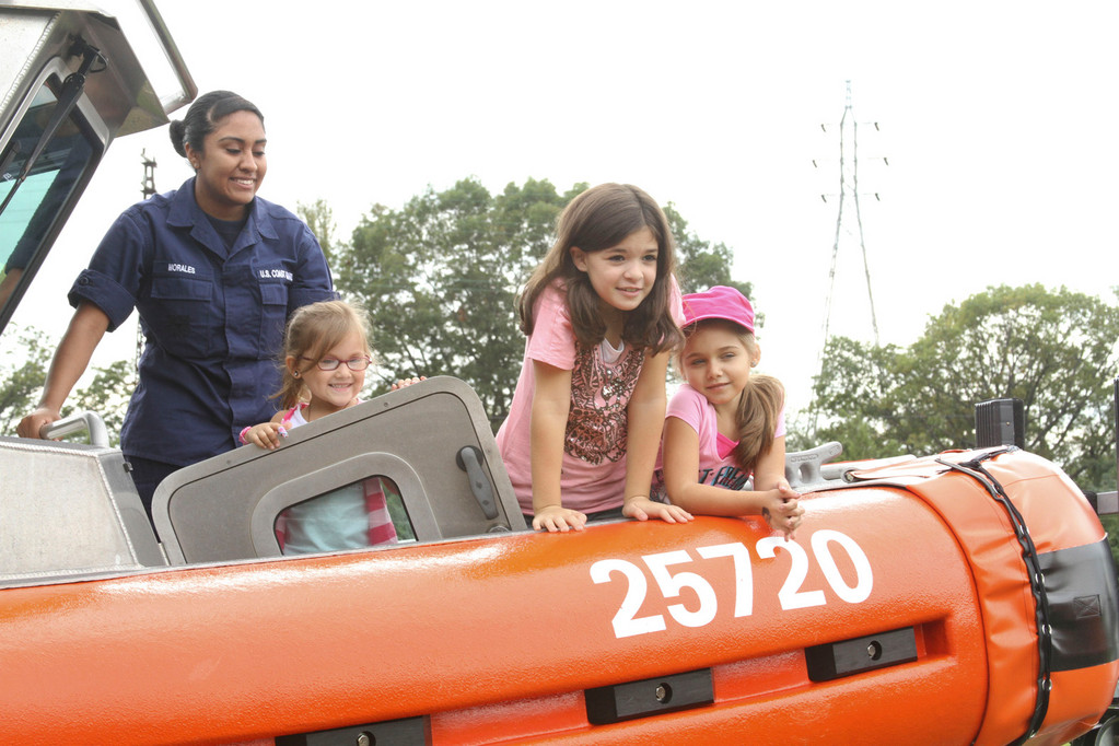 Victoria Vazquez,7 Haley 4, and Asheley Gentiluomo, 7 climbed on a Coast Guard boat.
