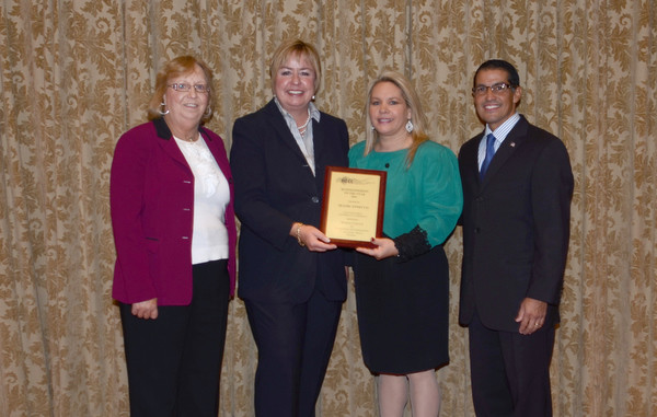 Congratulating Annecco were East Rockaway Chamber President Debbie Hirschberg, left, TOH Supervisor Kate Murray and Town Clerk Mark Bonilla.