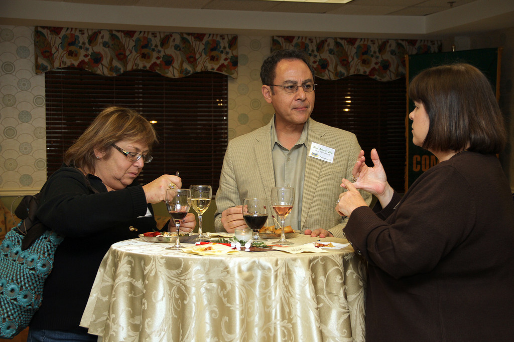 Debra Oliveri and Paul Oliveri, Esq. of Oliveri & Schwartz chat with Linda Stephenson of Bethpage Credit Union.