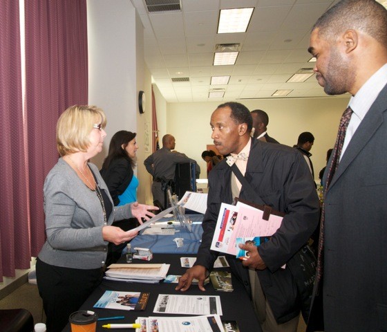 Geico recruiter Jeannie Toscano talked to Larry Thompson, at table, and Kariem Lebeet at last Saturday’s jobs fair, held at Elmont Memorial Library.