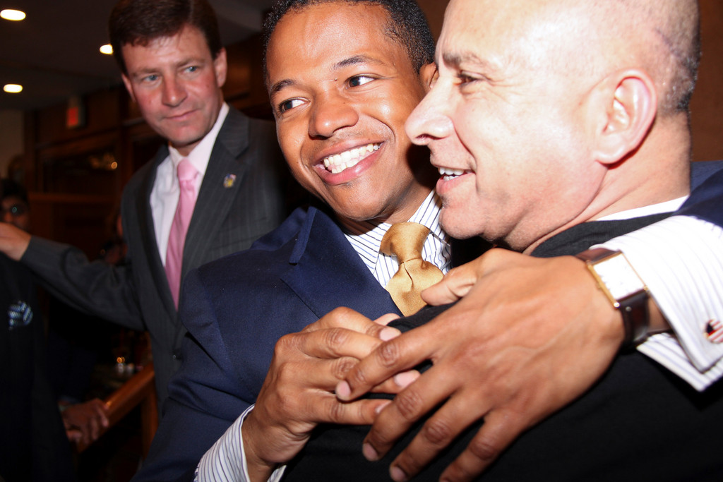 Carrié Solages, center, hugging Ali Mirza, upset eight-term Nassau County Legislator John Ciotti in the 3rd Legislative District on Tuesday.